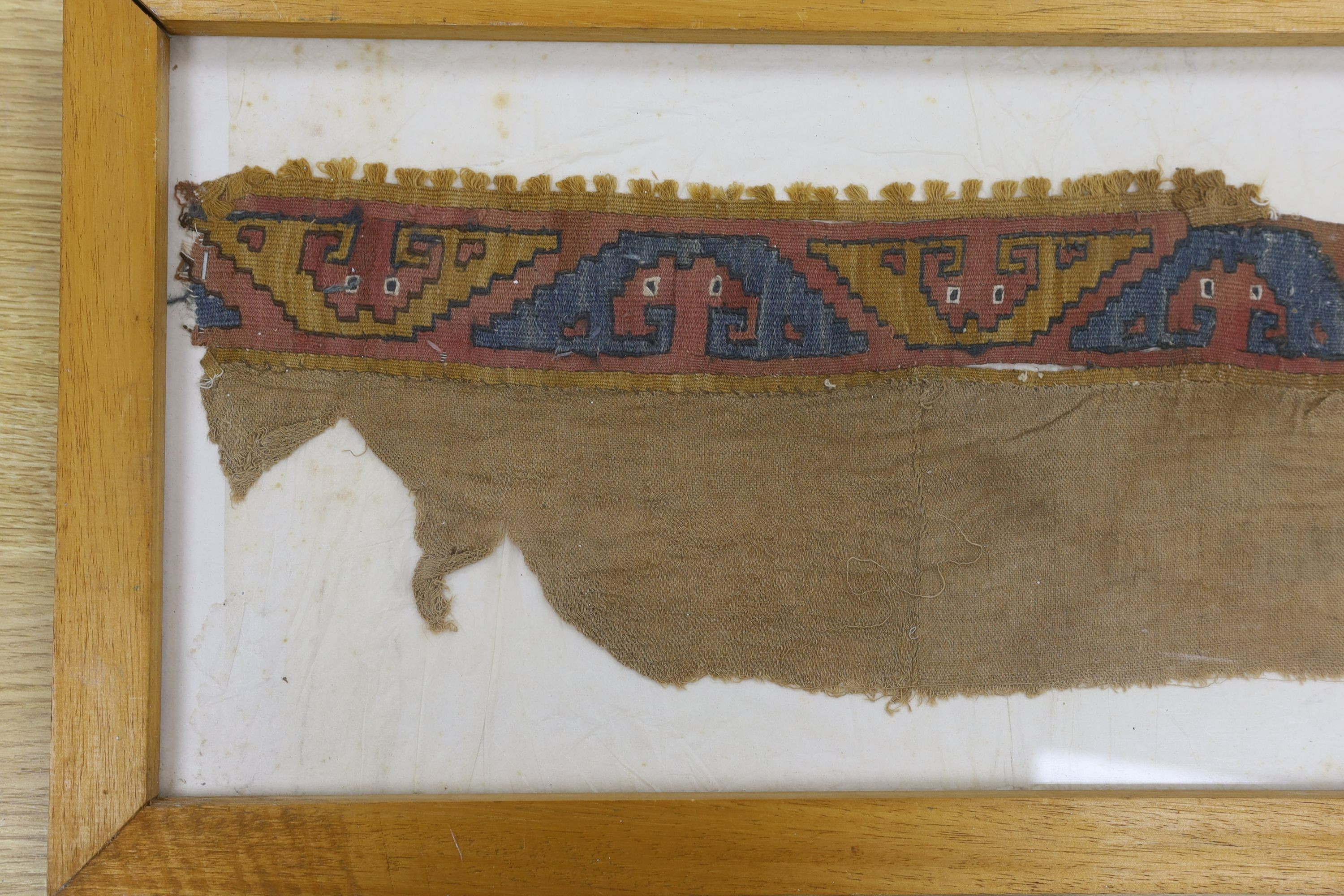 A pre-Columbian grave textile, framed